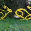 hares garden sculpture - yellow