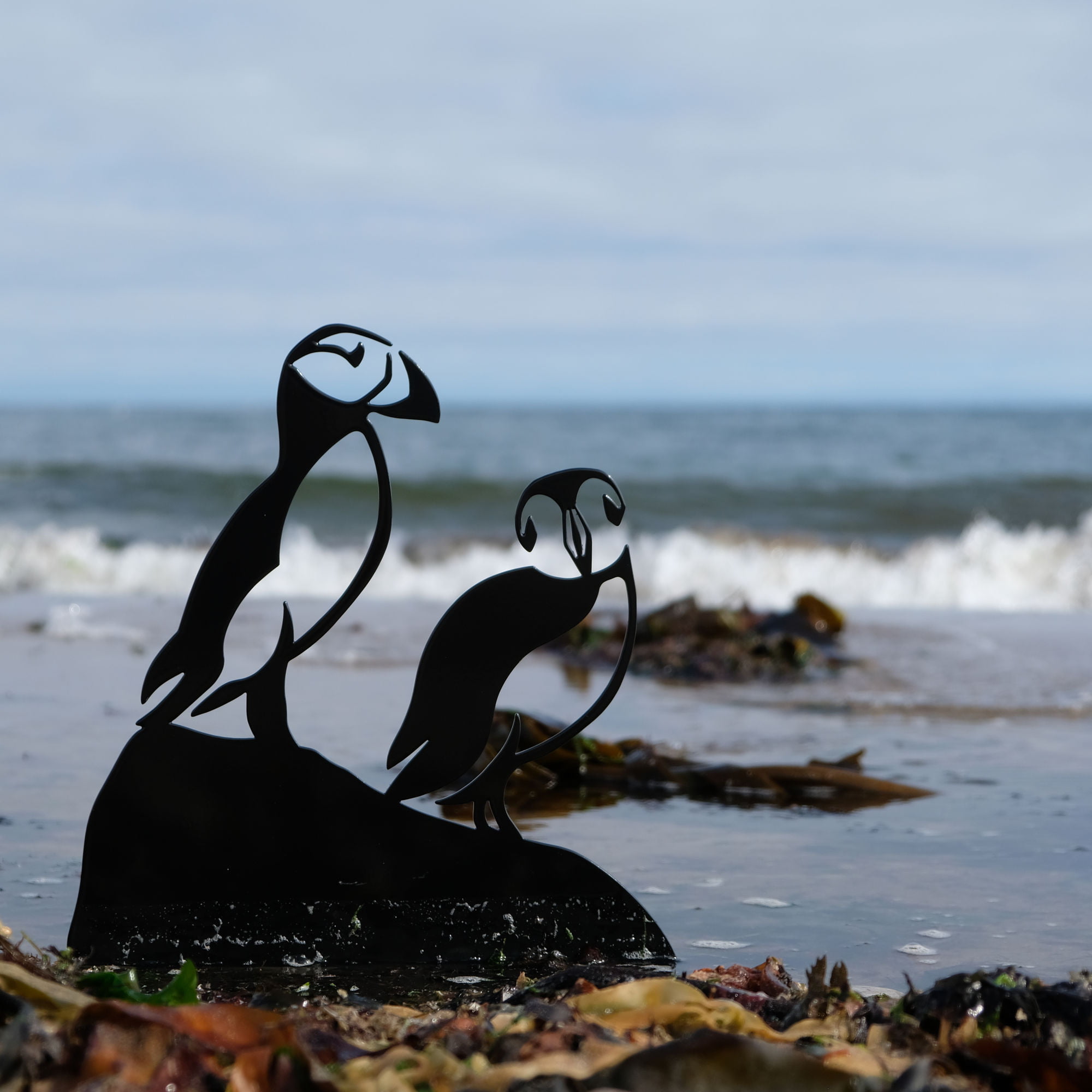 painted puffins sculpture