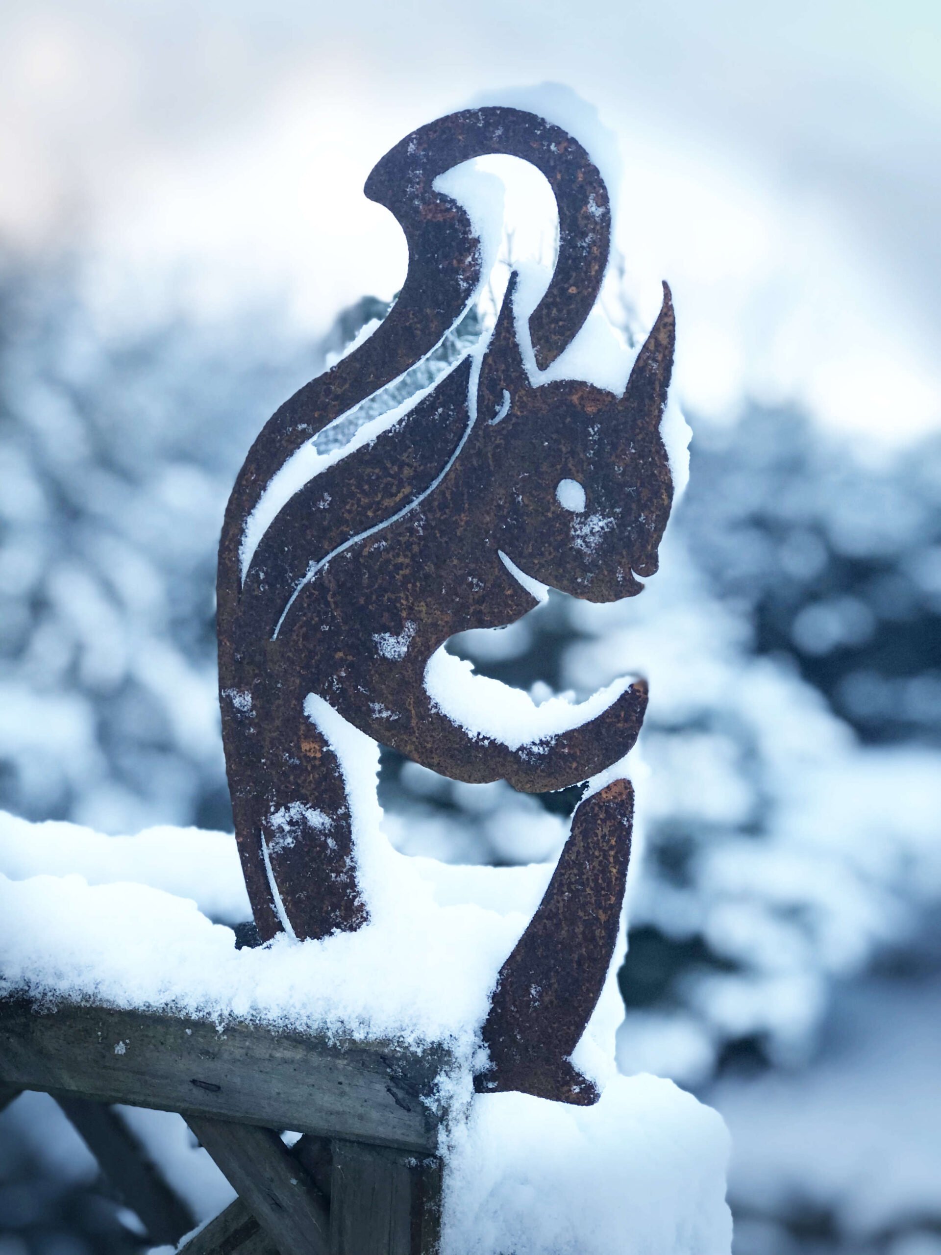red squirrel sculpture in snow red squirrel sculpture in snow